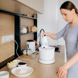 authentic-woman-using-handheld-mixer